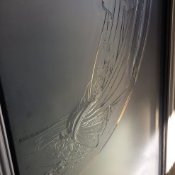 Etched glass panels from a women's boutique.